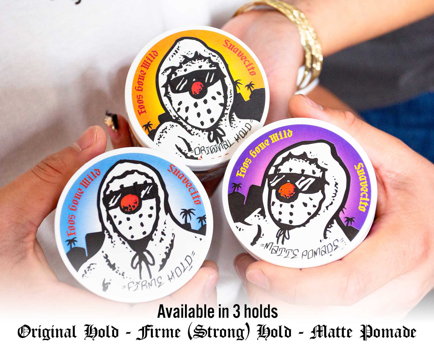 Three containers of 'Yaya Gone Wild' hair product with colorful labels held by a person.